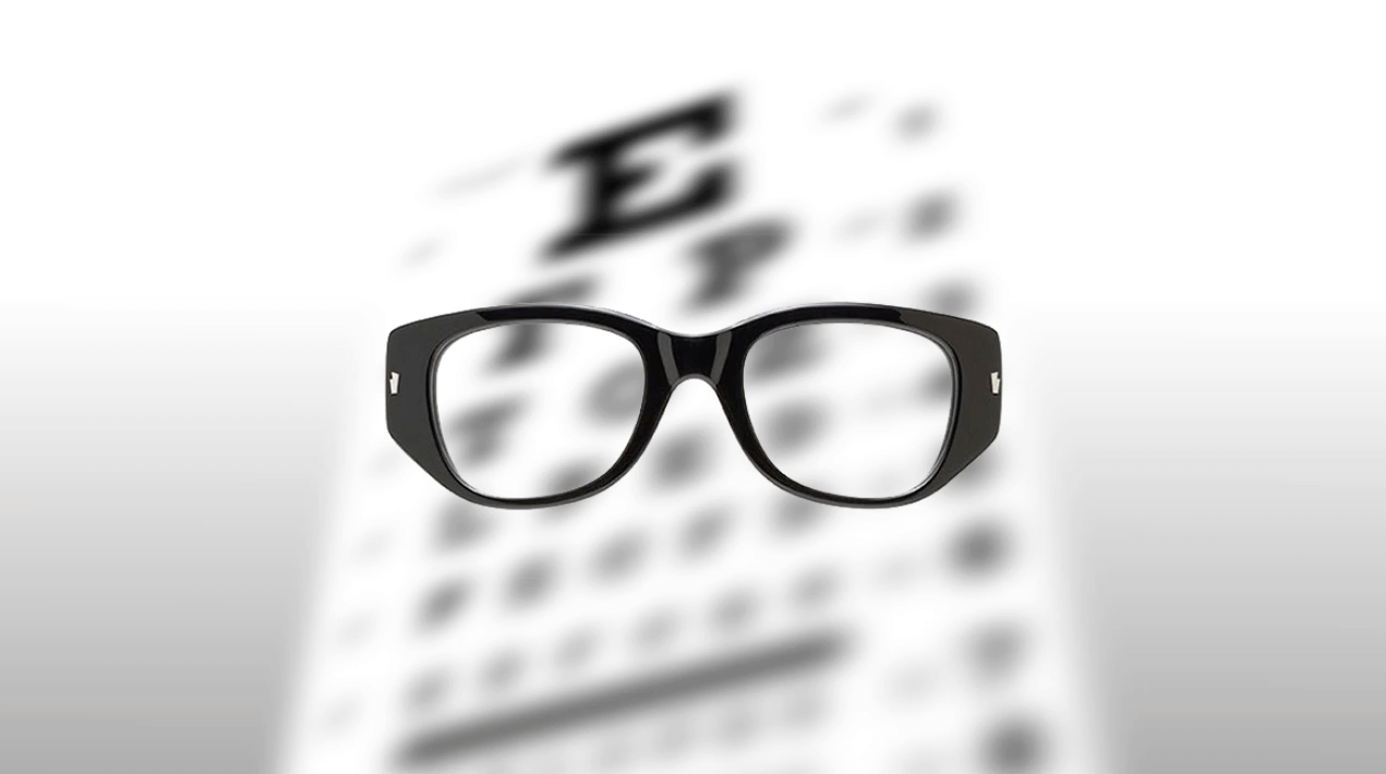 Glasses in Front of an Eye Chart